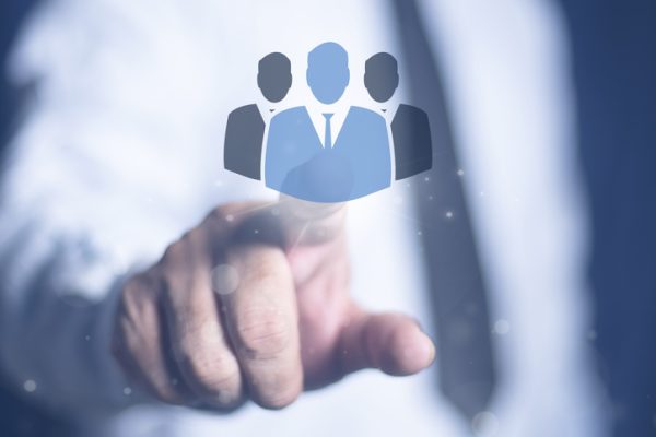 Business man hand touching person icon on virtual screen. Personnel recruitment concept, job placement, strategic planning for personnel management and teamwork for success.